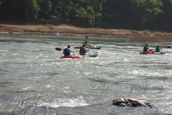 FULL DAY – Kuang Si Waterfall, Kayak on the Nam Ou / Mekong River, Pak Ou Caves - Whisky Village and the road to Kuang Si