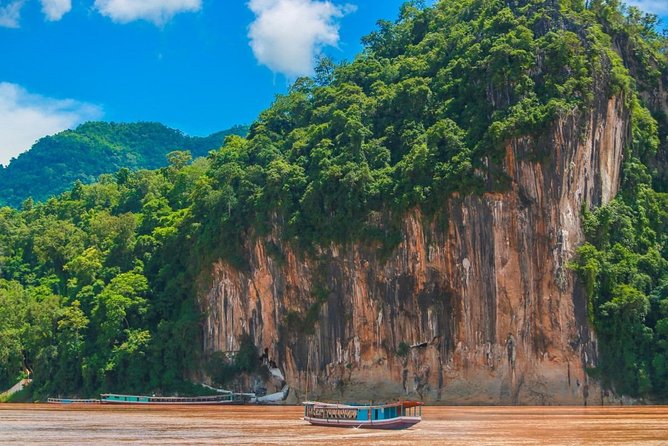 Pak Ou Caves and Kuang Si Fall Day Tour - A stop for rice wine and rural life