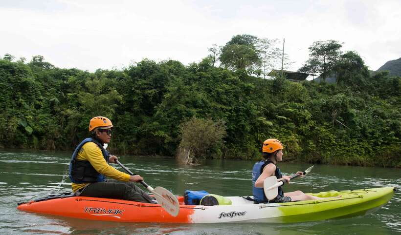 Vang Vieng: Kayaking & Cave Tubing with Zip Line/Blue Lagoon - Paddling the Nam Song beneath the limestone peaks